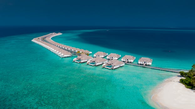 Flaming Maldives Overwater Villas Above Turquoise Lagoon